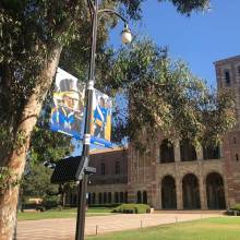 Flute and Bass Drum Banner in front of Royce Hall